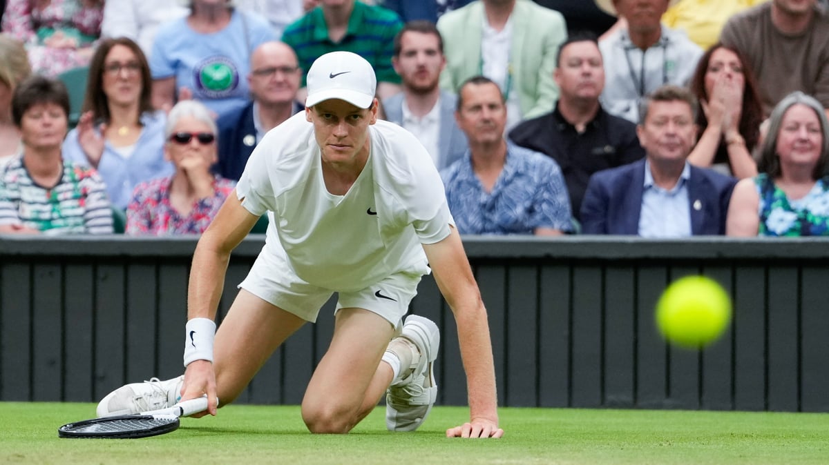  (AP Photo/Alberto Pezzali) : Jannik Sinner of Italy falls during his quarterfinal match against Daniil Medvedev of Russia at the Wimbledon tennis championships in London, Tuesday, July 9, 2024.